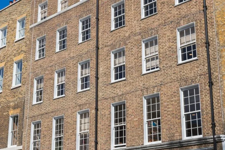 Facade,Of,A,Brick,Building,With,A,Symmetrical,Arrangement,Of